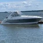 Formula 34 Performance Cruiser docked with full canvas cover