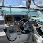 Raytheon E80 GPS and autopilot at helm of Formula 34 Performance Cruiser