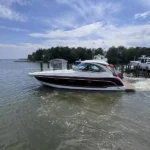 2012 Formula 45 Yacht “Redd Therapy” with Black Cherry hull, shown docked in Maryland, featuring Volvo IPS, FLIR, hardtop, and swim platform.