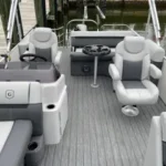 Pontoon boat with upgraded captain’s chair and sun lounge