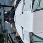 Bow area of Formula 34 Performance Cruiser with large sun pad and walk-through windshield access