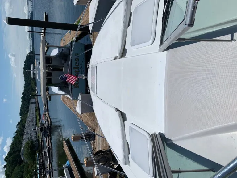 Bow area of Formula 34 Performance Cruiser with large sun pad and walk-through windshield access